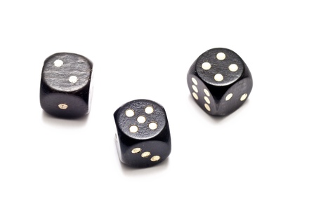 three black dices over a white backgroundの写真素材