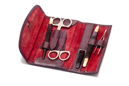 etui with scissors and tweezers over a white backgroundの写真素材