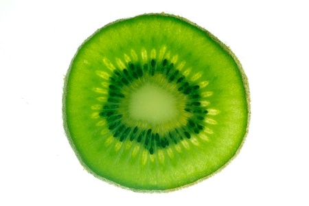 Close up of kiwi fruit slice isolated on white backgroundの写真素材