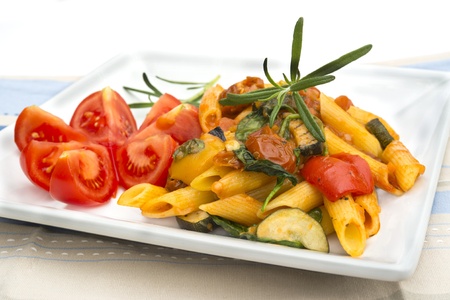 Mediterranean pasta dish with tomato and herbsの写真素材