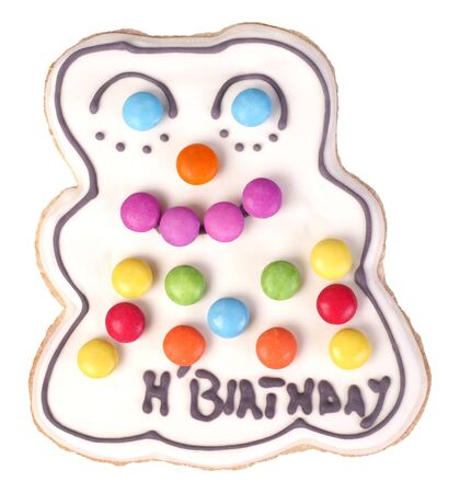 Gingerbread man cookie with smarties and happy birthday sign isolated on whiteの写真素材