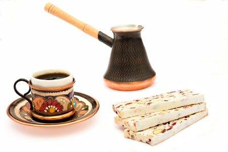 Nougat, cup of coffeee and turka on white backgroundの写真素材