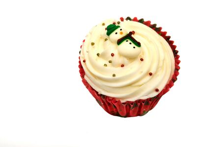 Christmas cupcake with snowman isolated on white backgroundの写真素材
