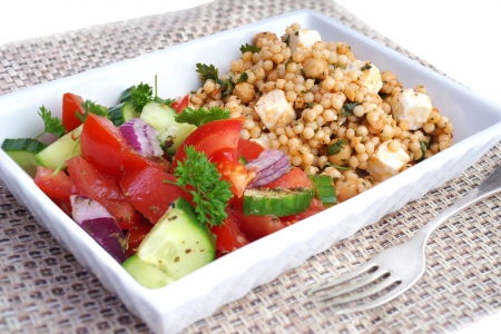 Giant couscous with feta cheese, tomato and herbsの写真素材