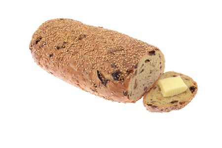Whole grain fruit and seeds loaf isolated on white backgroundの写真素材