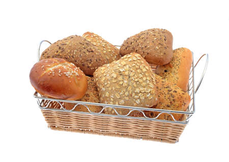 whole grain and white rolls in basket isolated on white backgroundの写真素材