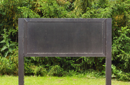                                notice board with trees on the background         の写真素材