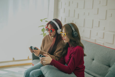 Couples play games together with a lot of joy, enthusiasm and concentration, taking turns to win and lose. A funny and exciting time. learning how to solve problems, think critically, and be creativeの写真素材