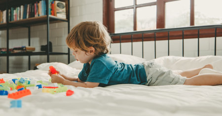 Apart from being fun educational toys and building blocks help kid develop brain, improve hand eye coordination, enhance fine motor skills, boost concentration, creativity and problem solving skillsの写真素材