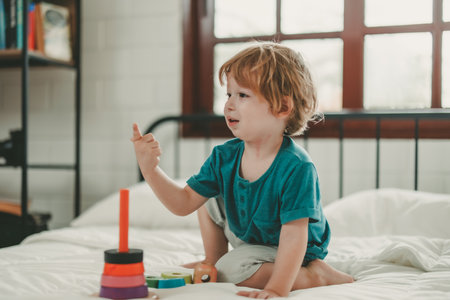 Apart from being fun educational toys and building blocks help kid develop brain, improve hand eye coordination, enhance fine motor skills, boost concentration, creativity and problem solving skillsの写真素材