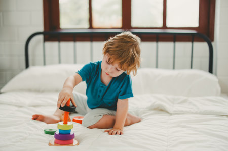 Apart from being fun educational toys and building blocks help kid develop brain, improve hand eye coordination, enhance fine motor skills, boost concentration, creativity and problem solving skillsの写真素材