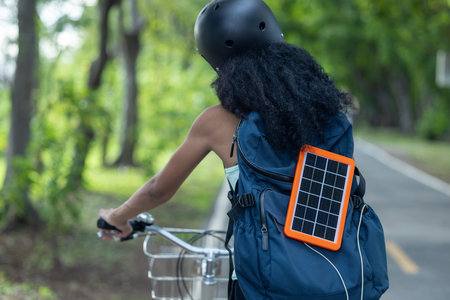 Female cyclist combine eco-consciousness with active lifestyle, using bikes for workout and travel,...