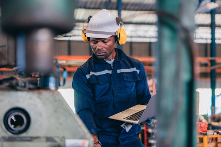 Industrial technician monitoring factory's inventory operation, analyzing smoothness, efficiency....
