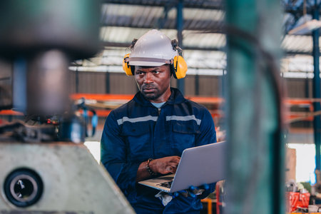 Industrial technician monitoring factory's inventory operation, analyzing smoothness, efficiency....