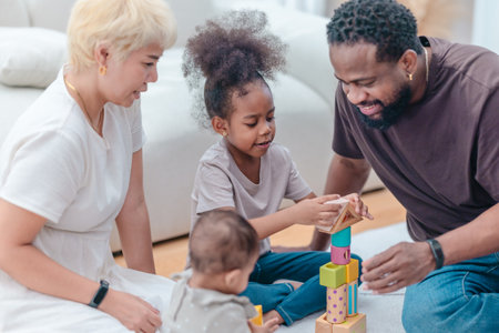Heartwarming scene of diverse family spending quality time together in living room. The group...