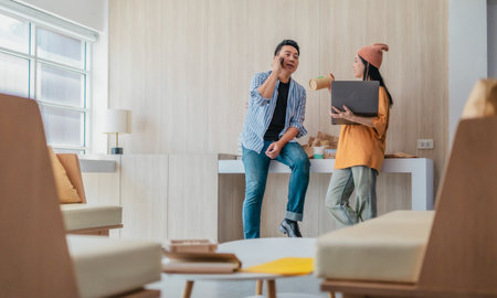 Two business partners evaluate various sustainable packaging materials in modern workspace. Highlighting creative collaboration, product design, and environmentally conscious business practices.の写真素材