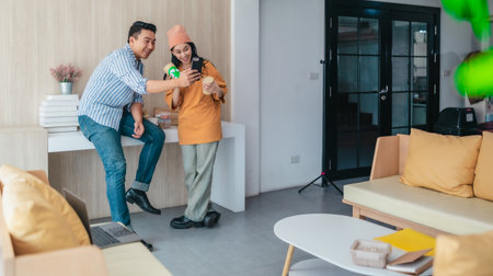 Two business partners evaluate various sustainable packaging materials in modern workspace....