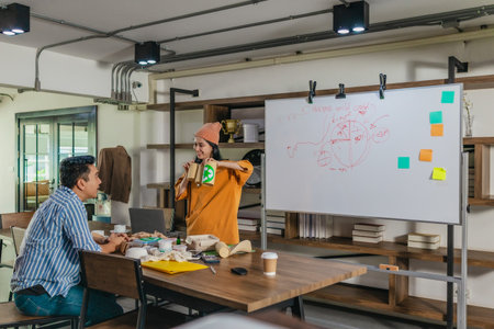 Creative startup team brainstorming innovative and eco-friendly packaging solutions. Reflecting...
