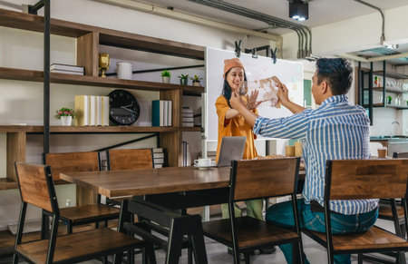 Creative startup team brainstorming innovative and eco-friendly packaging solutions. Reflecting sustainable thinking, teamwork, and product development in a dynamic business environmentの写真素材