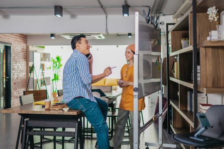 Startup team collaborates using Agile-style task board  to organize, plan, track the development of...
