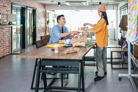 Startup team collaborates using Agile-style task board  to organize, plan, track the development of...