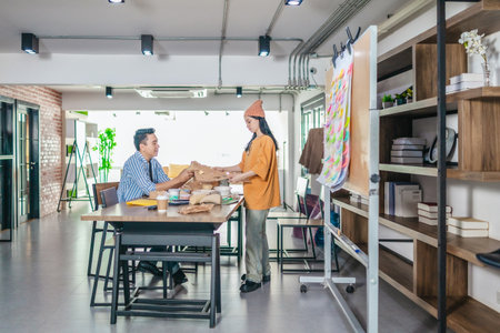 Startup team collaborates using Agile-style task board  to organize, plan, track the development of...