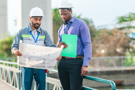 Engineer presents railway development proposal to investor during site visit, discussing green...