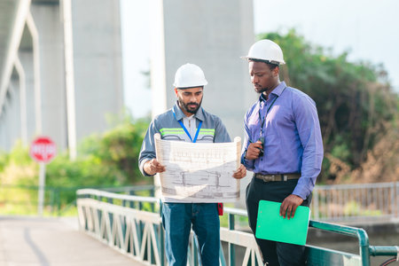 Engineer presents railway development proposal to investor during site visit, discussing green...
