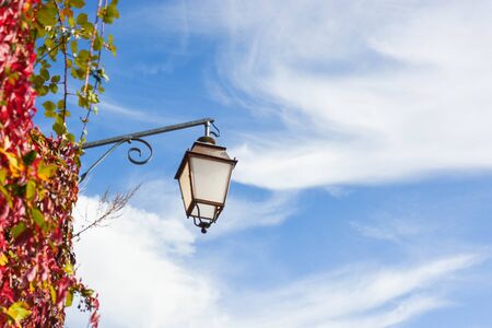 Street lamp with a partly cloud sky in Europeの写真素材