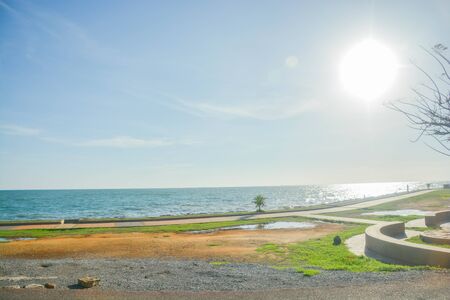 A scenery of park beside a beach in  Chanthaburi Thailand in the evening with blue sky and blue sea.の写真素材