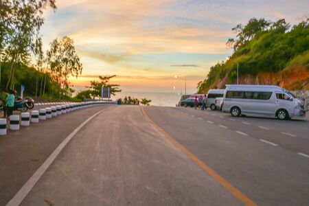 A road in the evening with partly cloud sky and mountain around the road in Chanthaburi Thailand.の写真素材