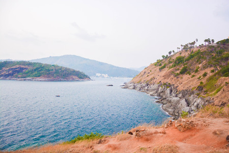 Seeing mountain through a strait of 2 islands in Phuket, Thailand with a small wave of sea. Taken from PromThep cape.の写真素材