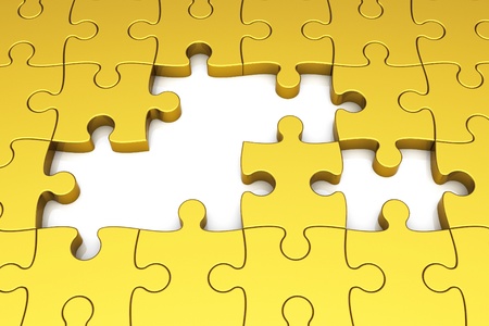 Gold puzzle pieces on white backgroundの写真素材