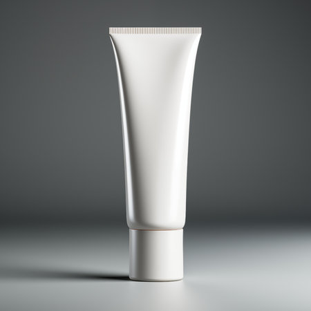 Slender cylindrical white hand cream tube mockup. The empty tube stands elegantly on a white background, providing a sleek canvas for your mockupsの素材