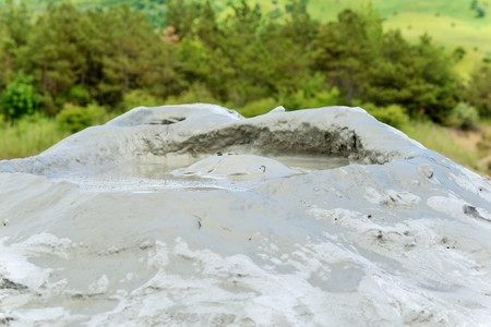 Mud volcano from Romania, refers to formations created by geo-exuded slurries usually including water and gases. There are several geological processes that may cause the formation of mud volcanoes.の写真素材