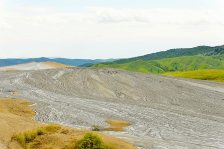 Mud volcano from Romania, refers to formations created by geo-exuded slurries usually including water and gases. There are several geological processes that may cause the formation of mud volcanoes.の写真素材