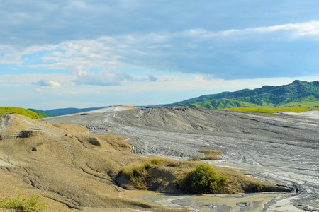 Mud volcano from Romania, refers to formations created by geo-exuded slurries usually including water and gases. There are several geological processes that may cause the formation of mud volcanoes.の写真素材