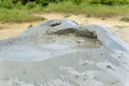 Mud volcano from Romania, refers to formations created by geo-exuded slurries usually including water and gases. There are several geological processes that may cause the formation of mud volcanoes.の写真素材