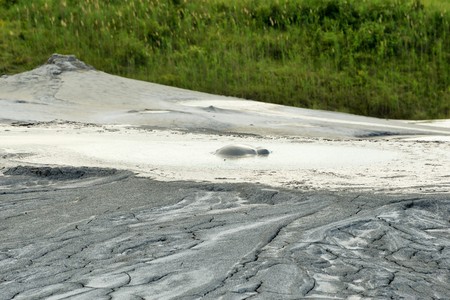 Mud volcano from Romania, refers to formations created by geo-exuded slurries usually including water and gases. There are several geological processes that may cause the formation of mud volcanoes.の写真素材