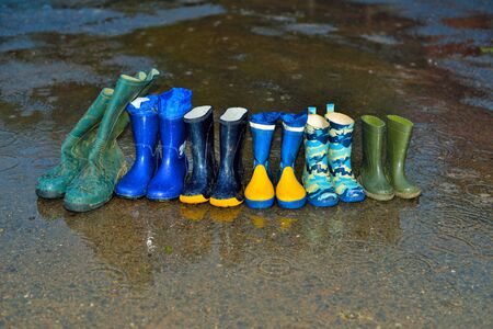 Several pairs of rubber boots, of a family that lives on a farmの写真素材