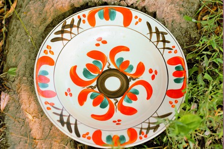 Unique and handmade clay painted plates, 50 years old, from creative peopleの写真素材