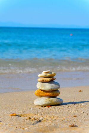Tower of stones on a tranquil beachの写真素材