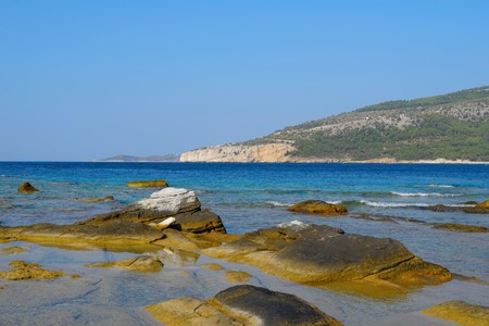 Aliki. From the archaic period until the Byzantine era, Aliki was one of the main Greek areas regarding the mining and exportation of marble. Nowadays, we can still trace the results of the ancient mining techniques through the sculptured rocks of the areの写真素材