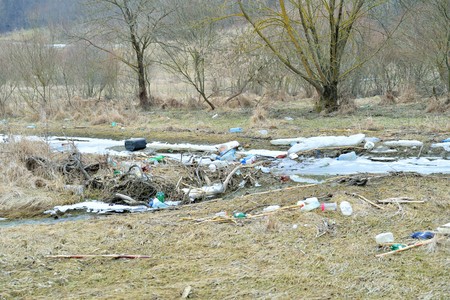 Garbage in nature. Plastic bottles left after water was withdrawnの写真素材
