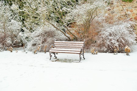 A snow covered benchの写真素材