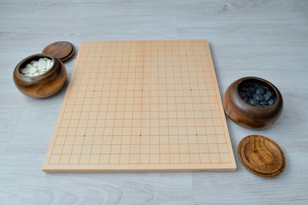 Go game set. Go is an abstract strategy board game for two players, in which the aim is to surround more territory than the opponentの写真素材