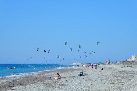 Kiteboarding in Agios Nikita Beach, Lefkada Island,Greece, August 25, 2017,  a beach full of people practicing kiteboardingの写真素材