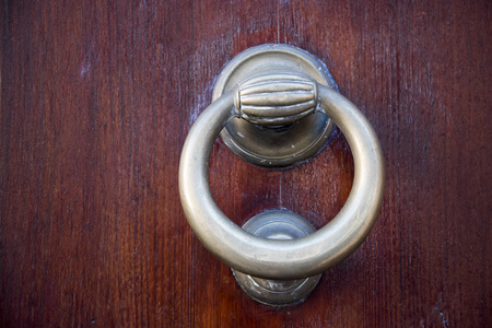Decorative metal ring knock door, in Italy most homes have doors with these handles.