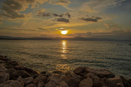 Sunset in Malinska, a settlement in the northwestern part of the island Krk in Croatia and an important tourist town. It lies on the coast of the Adriatic Seaの写真素材