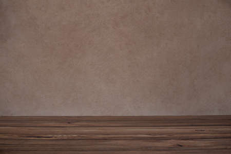 Background for photo sessions consisting of brown wall and wooden floorの写真素材